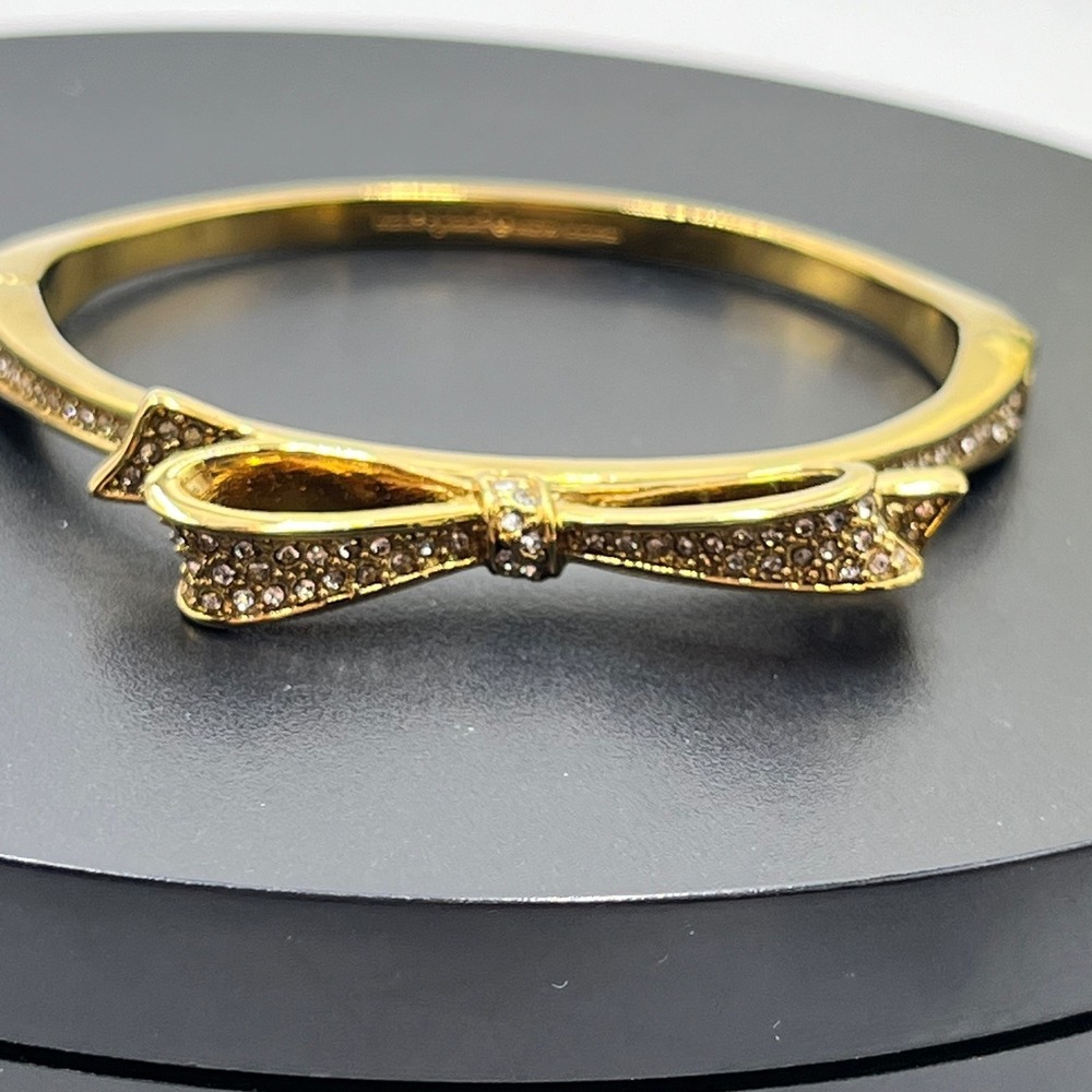 Kate Spade NY Love Notes Gold Plated Pave Crystal Bow Hinged Bangle Bracelet